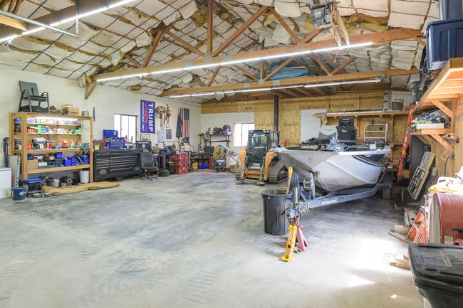 Garage featuring a workshop area | Image 7