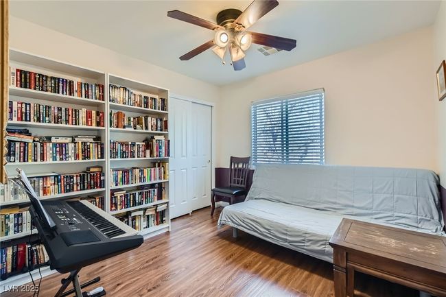 Third bedroom area featuring wood finished floors and ceiling light/fan | Image 19