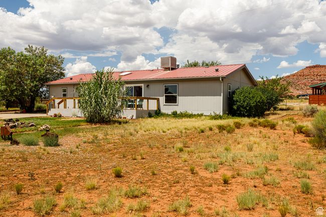 Back of property with central AC unit and a deck | Image 31