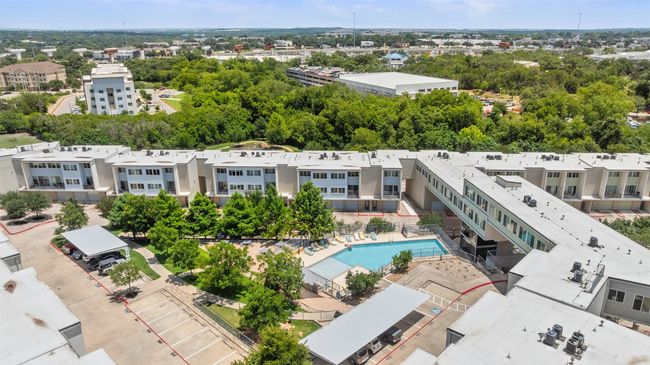 Aerial view of a pool and a tree filled landscape | Image 20