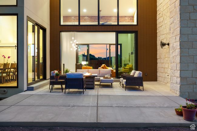 Patio terrace at dusk featuring an outdoor living space and a patio area | Image 80