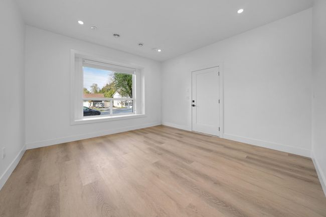 Spare room featuring light wood-type flooring, baseboards, and recessed lighting | Image 21