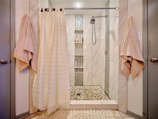 The updated oversized shower features dual control valves and shower heads. | Image 23