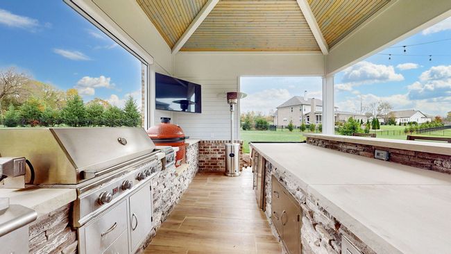 Grill, Side Burners, Large Griddle, Refrigerator & Brand New Kamado Joe Smoker. What else do you need?!! | Image 58