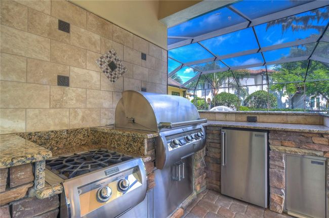 Imagine grilling up masterpieces on the state-of-the-art equipment, surrounded by elegant stonework and seamless granite countertops. | Image 32