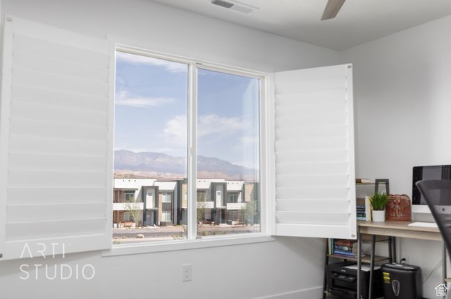 Interior space with a mountain view, visible vents, and a ceiling fan | Image 26