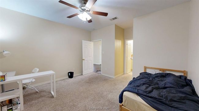 Bedroom featuring carpet, visible vents, a ceiling fan, and baseboards | Image 12