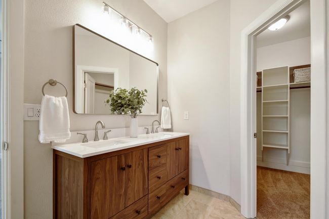Bathroom featuring double vanity and a spacious closet | Image 17