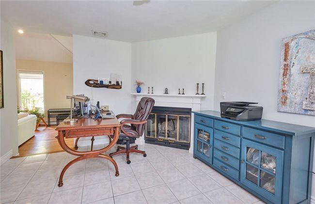 Office with light hardwood / wood-style flooring | Image 23