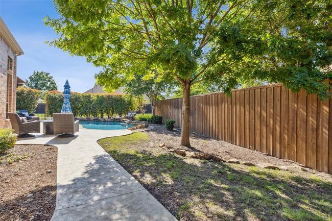 View of yard featuring a fenced in pool and a patio area | Image 36