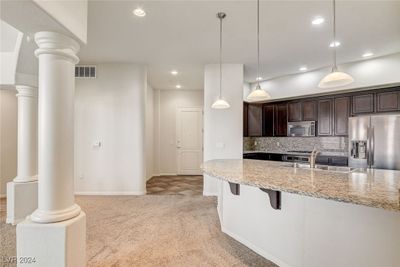 Foyer that opens to the kitchen and dining area | Image 3