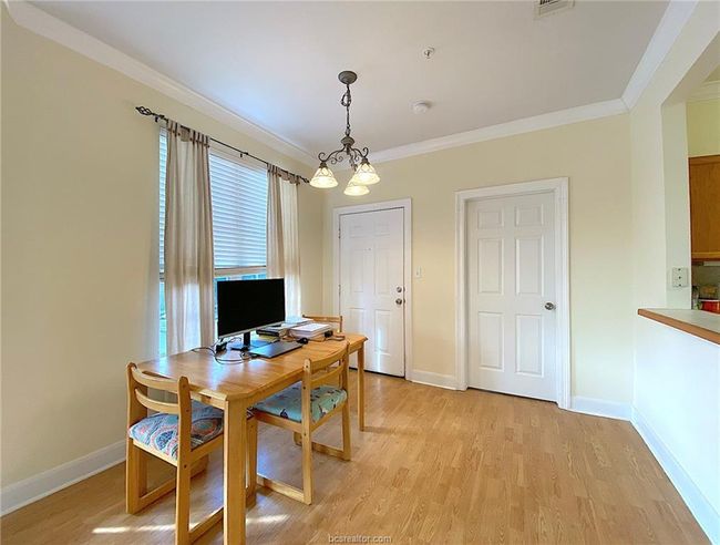 Home office featuring crown molding, light wood-type flooring, and baseboards | Image 4