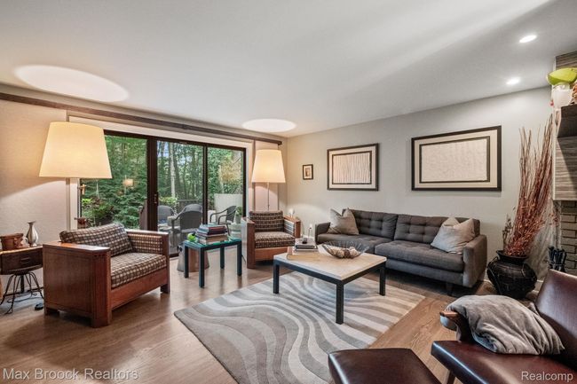 Living room with hardwood floors, neutral paint | Image 11