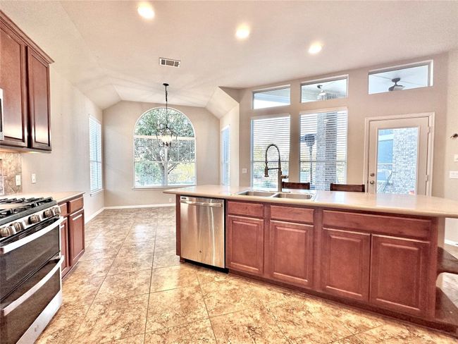 Kitchen overlooks back patio and yard. Great for keeping an eye on littles. | Image 8