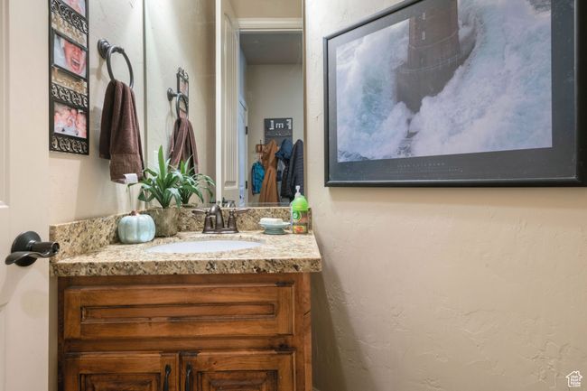 Bathroom with vanity and a textured wall | Image 12