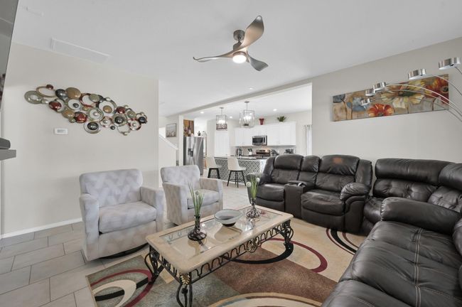 Yes! You can watch TV from the kitchen while you prepare meals for family and friends. The support beam adds architectural interest and helps define the different spaces. | Image 14