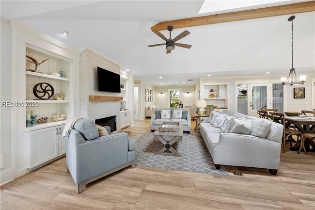 Great Room with tabby fireplace and custom built-ins | Image 9