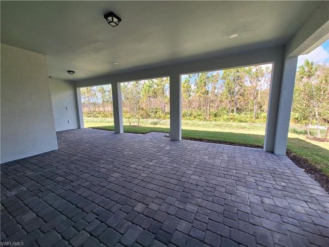 Spacious covered lanai backyard space can accommodate pool after closing | Image 7