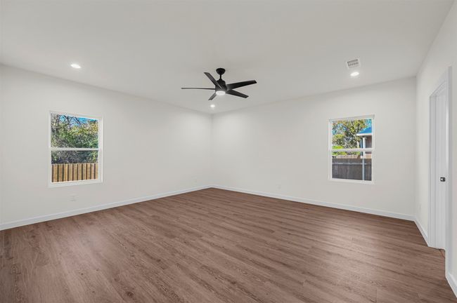 Unfurnished room with recessed lighting, ceiling fan, wood finished floors, and plenty of natural light | Image 17