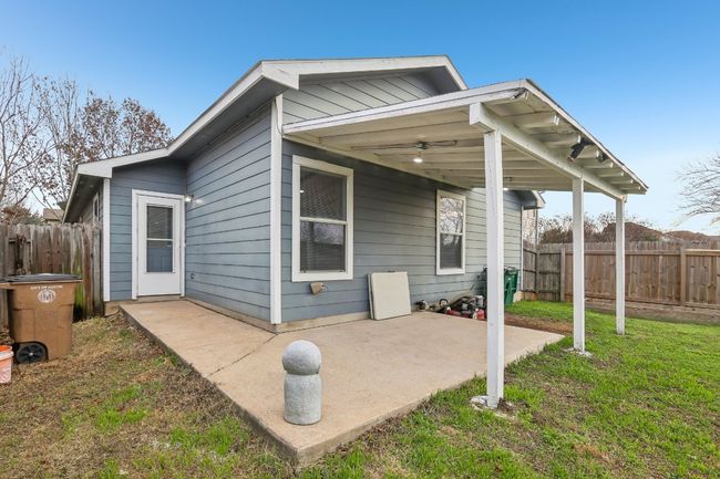 Back of property with a patio, a lawn, and fence | Image 22