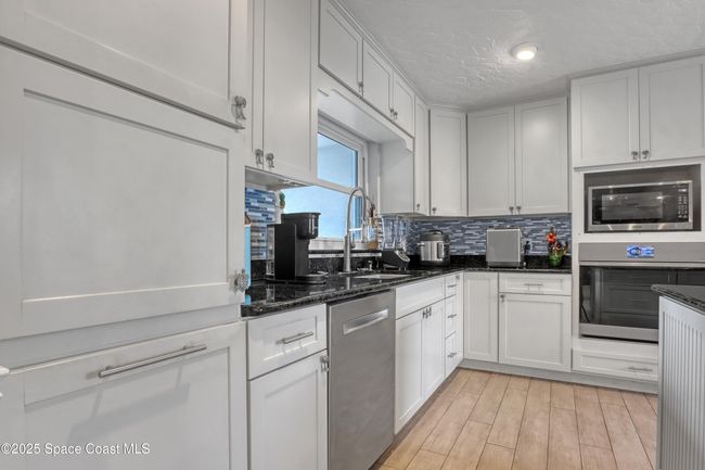 1061 Bali Rd, House other with 4 bedrooms, 2 bathrooms and null parking in Cocoa Beach FL | Image 18