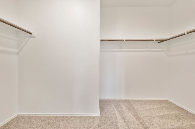 Spacious closet featuring carpet floors | Image 23