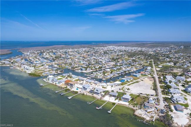 Birds eye view of property with a residential view of the Southern tip of Pine Island and a water view of the bay | Image 32