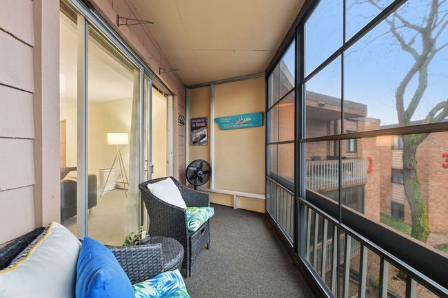 Private balcony becomes a clean protected interior space with “EZ Screen” enclosing vinyl windows. | Image 25