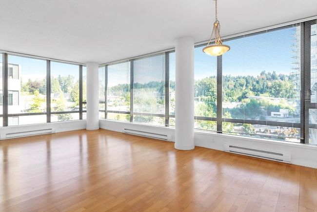 Unfurnished sunroom with a baseboard radiator and healthy amount of natural light | Image 9