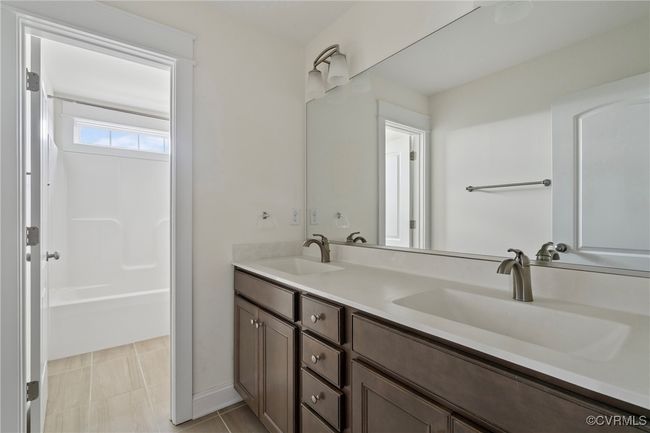 Bathroom with double vanity and washtub / shower combination | Image 33