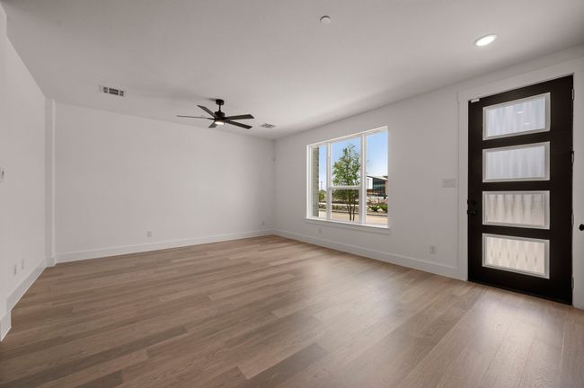 This spacious, light filled family room is the perfect place to host friends and family! | Image 5