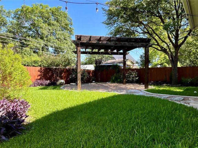 View of yard featuring a pergola and a patio area | Image 33