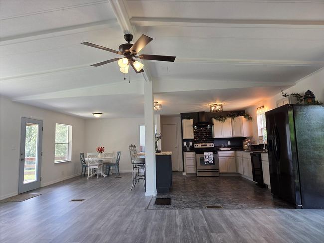View from Living Room to Kitchen and Dining Area, Vaulted Ceiling | Image 11