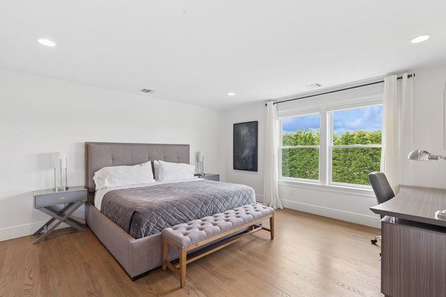 Bedroom featuring wood finished floors, baseboards, and recessed lighting | Image 14