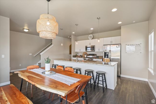 Dining area with stairway, dark wood finished floors, baseboards, and recessed lighting | Image 12