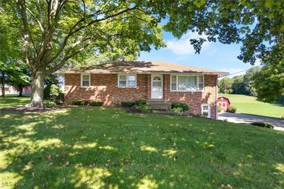 Single story home featuring a front lawn | Image 1