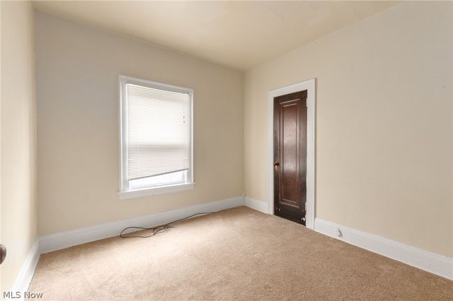 View of carpeted spare room | Image 14