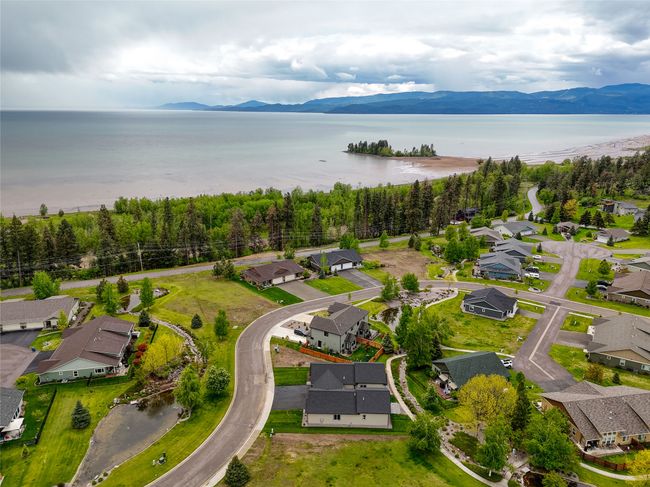 Aerial view of residential area featuring a water and mountain view | Image 30
