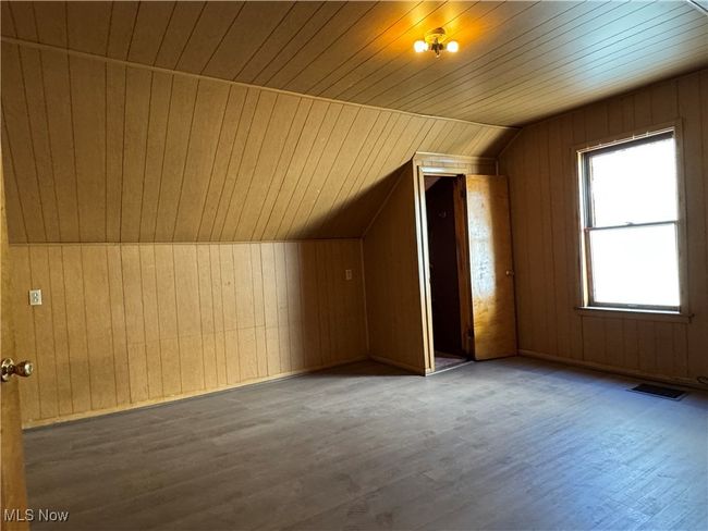 Bonus room with wooden walls, visible vents, lofted ceiling, wooden ceiling, and wood finished​​‌​​​​‌​​‌‌​‌‌​​​‌‌​​‌‌​‌​​​​​‌ floors | Image 27