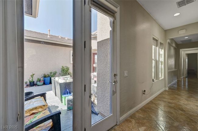Entryway featuring baseboards and tile patterned floors | Image 36