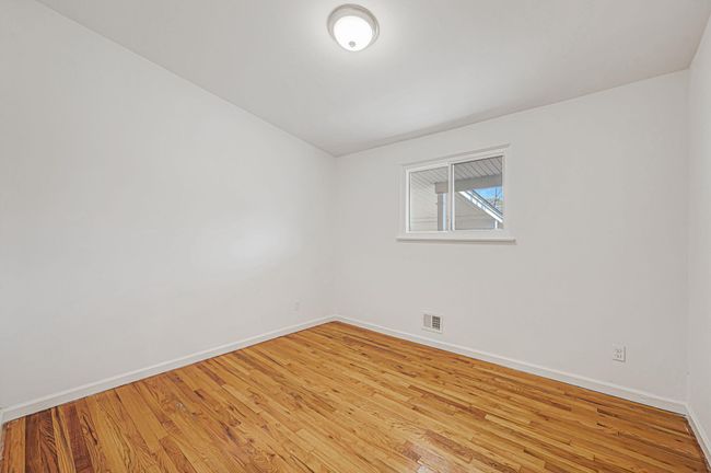 Unfurnished bedroom featuring light wood-style flooring, baseboards, and a closet | Image 14