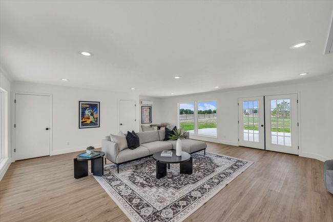 Living area with baseboards, recessed lighting, and light wood-style floors | Image 23