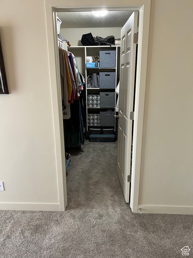 Spacious closet with carpet flooring | Image 28