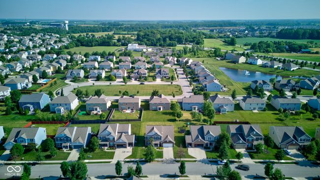 aerial view of property and surrounding area featuring a large body of water and nearby suburban area | Image 56