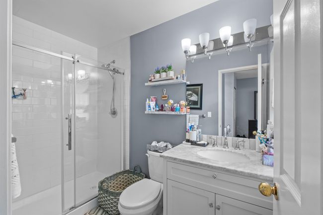 Full bath with a shower stall and vanity | Image 9