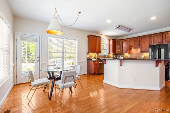 Open to the Kitchen, the breakfast area offers ample space for everyone to enjoy a meal together. | Image 16