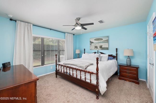Spacious primary suite offers comfort, privacy, and a peaceful retreat. | Image 11