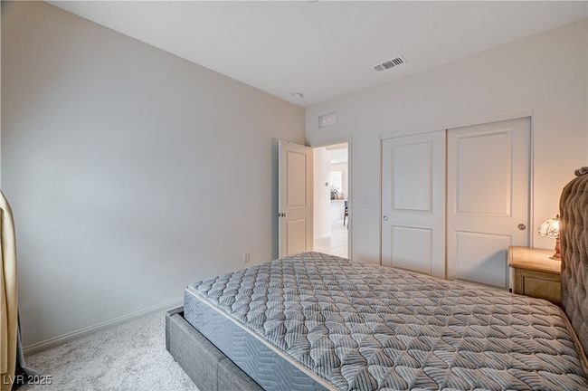 Carpeted bedroom with baseboards and a closet | Image 30