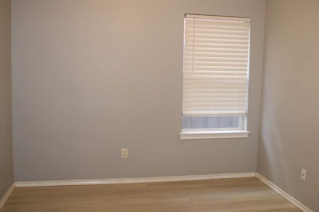 Unfurnished room with baseboards and wood finished floors | Image 12