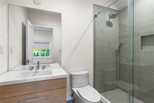 Full bath with a shower stall, toilet, and vanity | Image 40